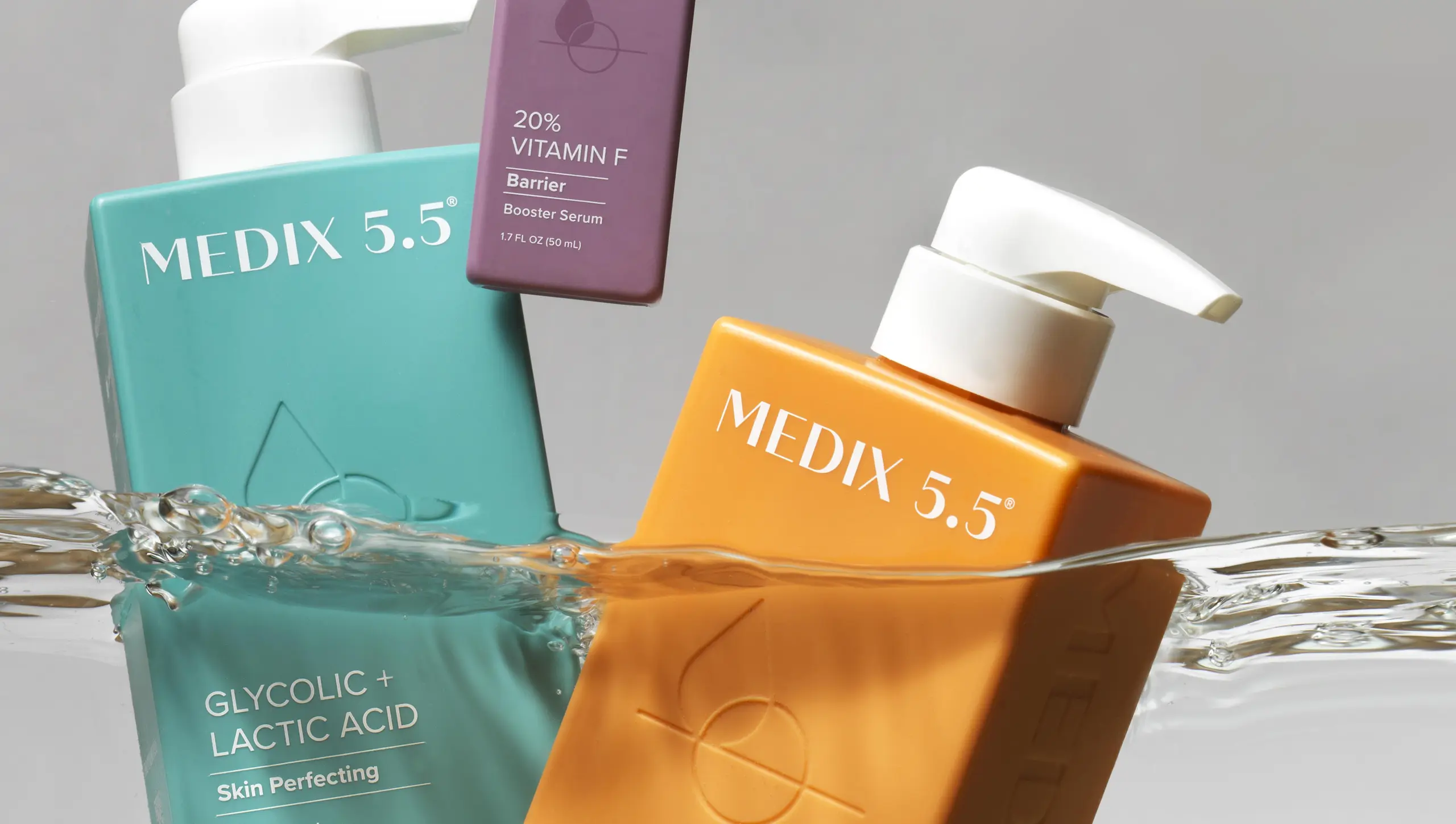 Medix 5.5 body care bottles splashing in water